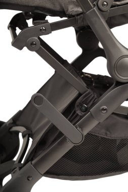 Beyaz bir arka planda bir bebek arabası yakın çekim ayrıntılarını bir bebek arabası.