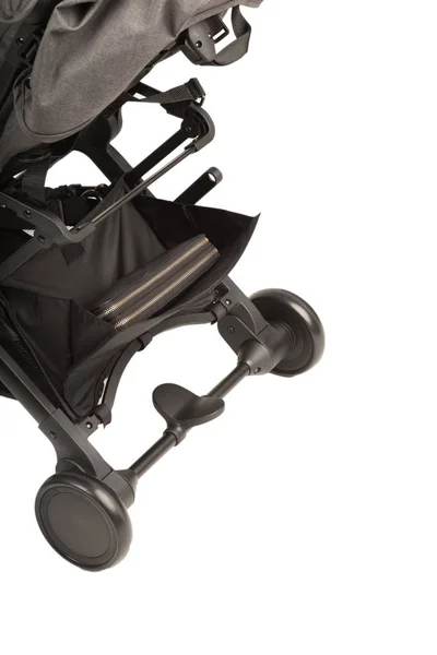 A stroller on a white background, details of a stroller close-up. — Stock Photo, Image