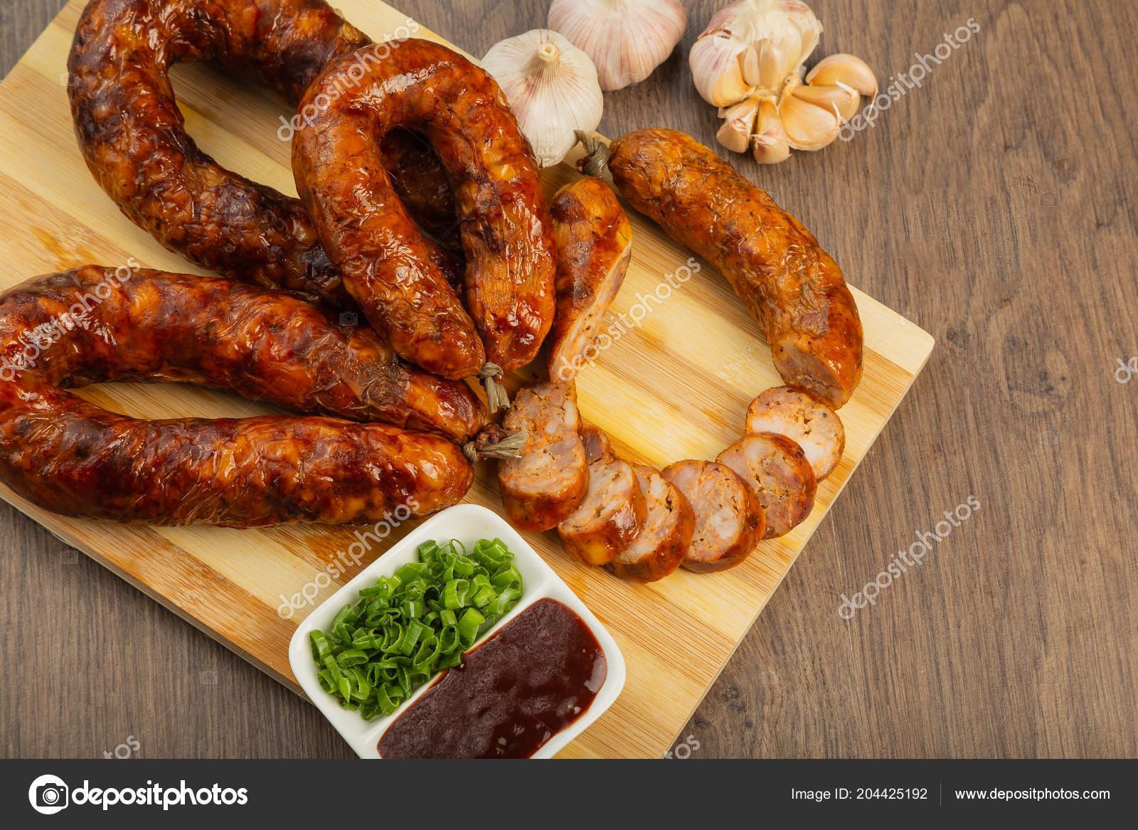 Homemade sausage on a wooden background