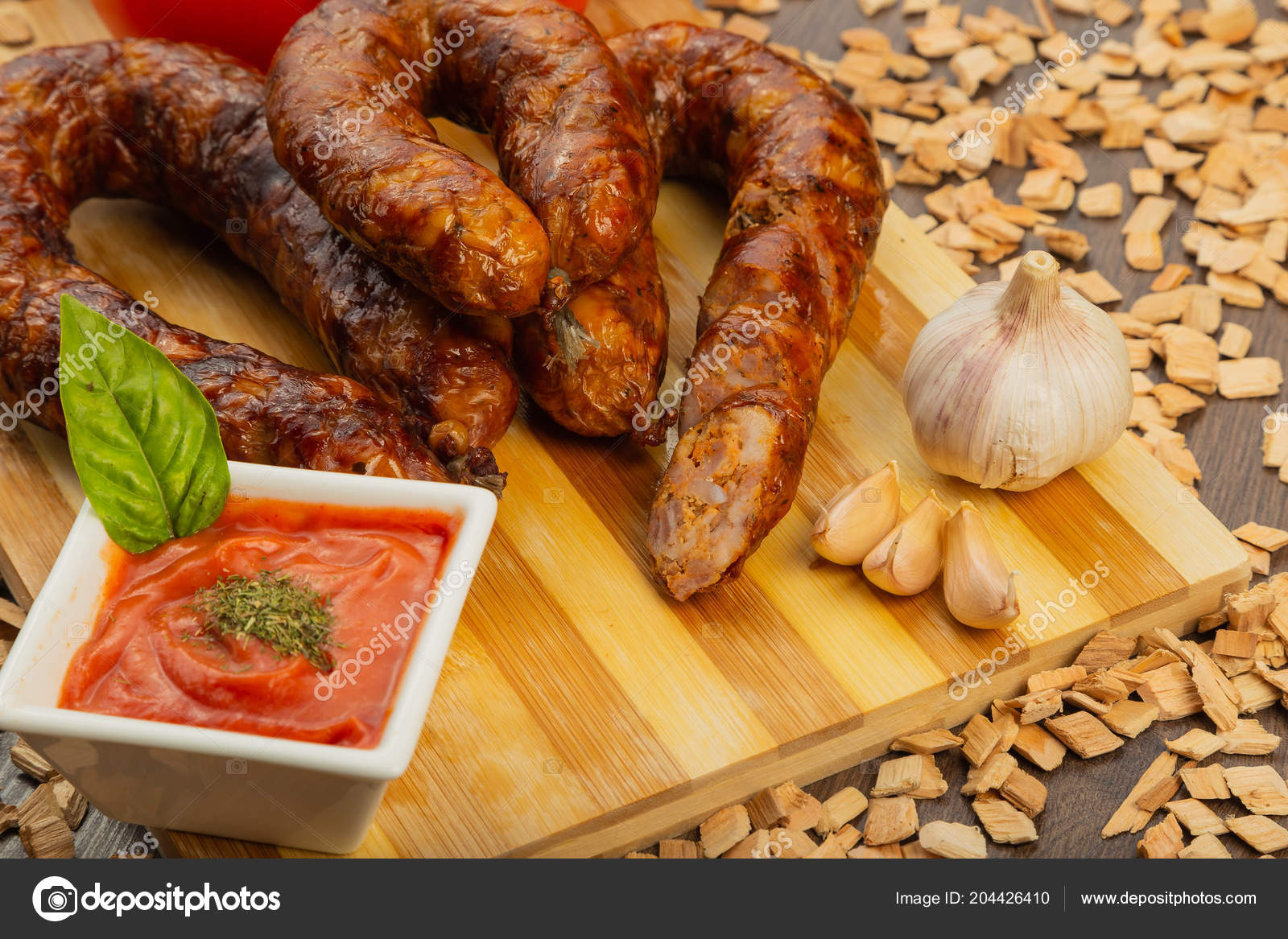 Homemade sausage on a wooden background