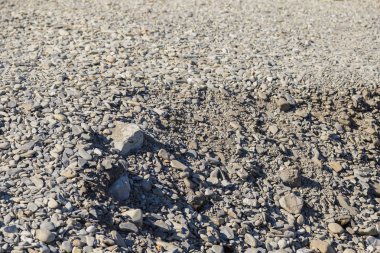 İç dekorasyon ve endüstriyel yapı tasarımı için taş çakıl taşı dokusu arka planı.