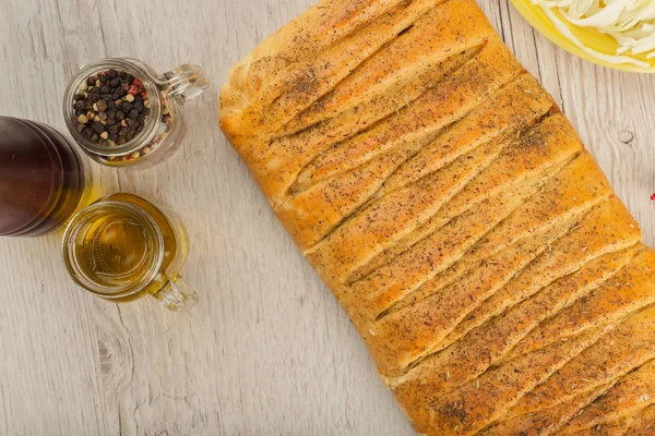 Pie with cabbage and mushrooms on a wooden background with ingredients. — Stock Photo, Image