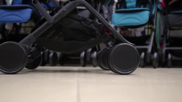 Details of a baby stroller in a close-up shop. — Stock Video