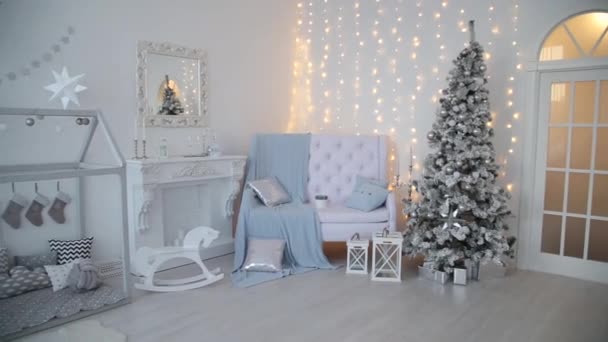 2019. New year 2019. New Years decor, colorful garlands, Christmas socks. Christmas tree on the Christmas tree. Interior decor. A party. Waiting for the holiday. Bokeh, the blue light. New Year — Stock Video