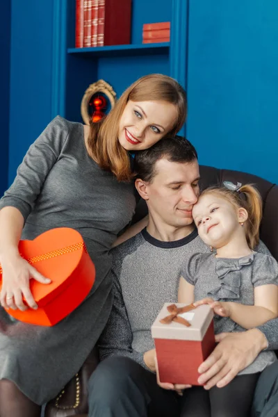 Very cheerful and beautiful family in the New Year room . — стоковое фото