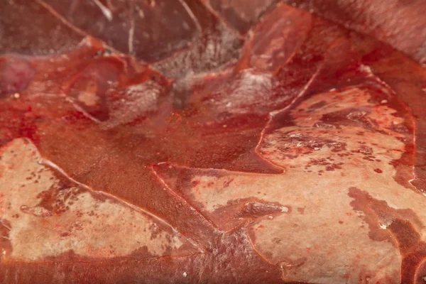 Frozen fresh beef liver in blocks, texture of frozen liver.