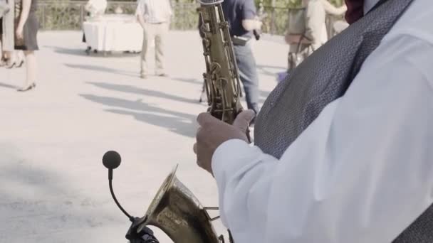 Saxophonist in dinner jacket play on golden saxophone. Live performance. Jazz music — Stock Video