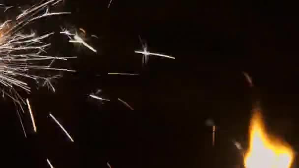 Sparklers burn at night, bright light. — Stock Video