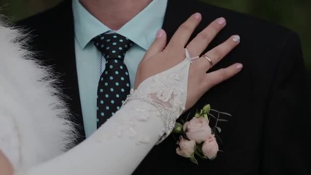 Newly married couple holding hands. Wedding flowers. Close-up. — Stock Video