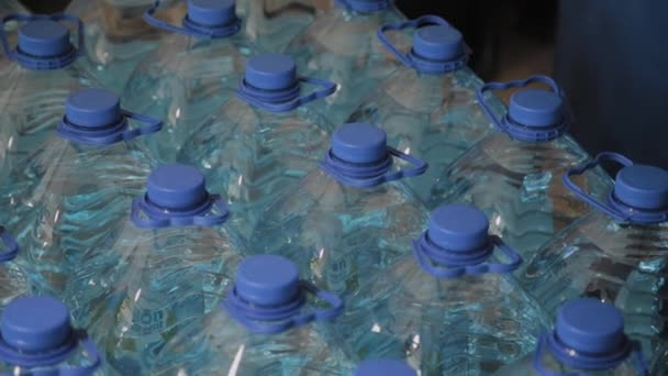 Blue plastic drinking water bottles in large quantities. — Stock Video