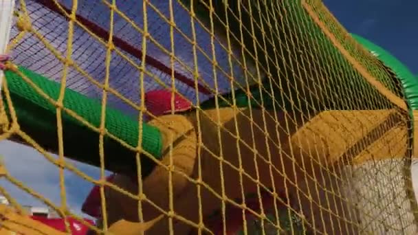 Sturdy net on an inflatable playground. — Stock Video