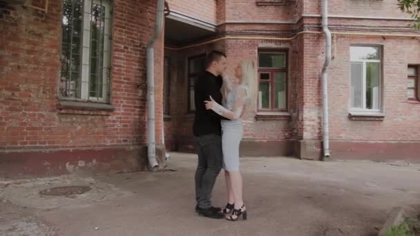 Beautiful happy couple in love dancing in the old courtyard. — Stock Video