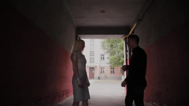 Happy couple in love standing under the arch at home and holding hands. — Stock Video