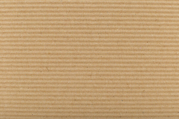 гофрированный картон для упаковки. абстрактные горизонтальные линии фона с волнистыми линиями бежевого цвета