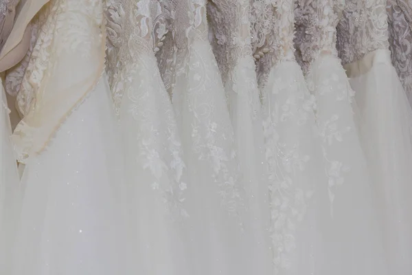 Beautiful wedding dresses in a bridal salon. — Stock Photo, Image