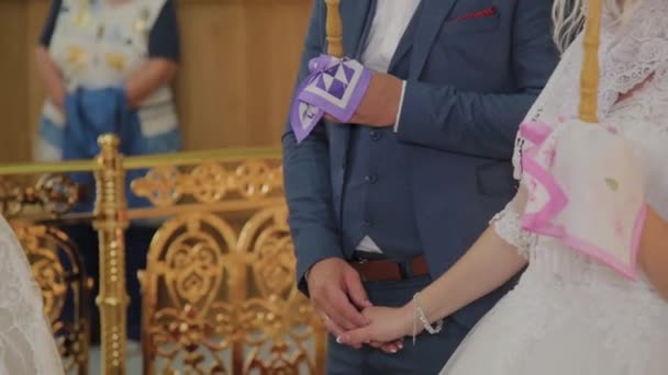 Newlyweds at the wedding ceremony in the church. — Stock Video