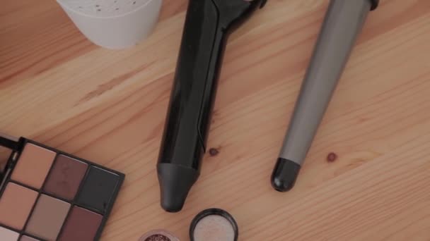 Professional makeup kit in a makeup studio on a wooden table. — Stock Video