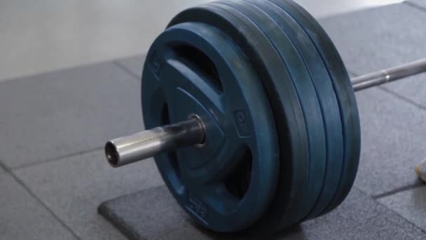 Large barbell with discs in the gym. — Stock Video