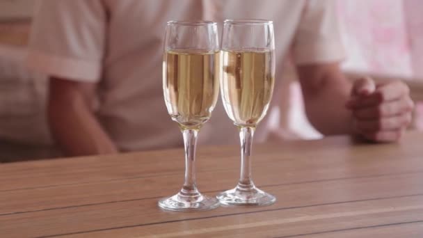 Beautiful couple in love with champagne in a restaurant. — Stock Video