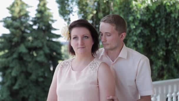 Beautiful loving couple cuddling in a terrace restaurant. — Stock Video