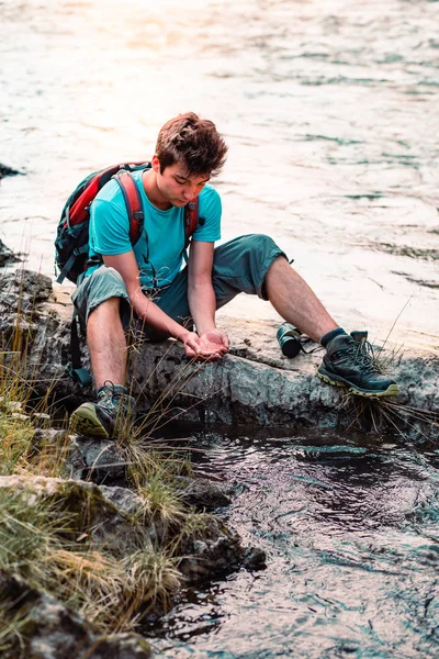 Young Boy Takes Pure Water River Holds Hands Sitting Rock — Stock Photo, Image
