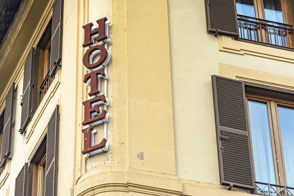 Hotel sign on wall facade — Stock Photo, Image