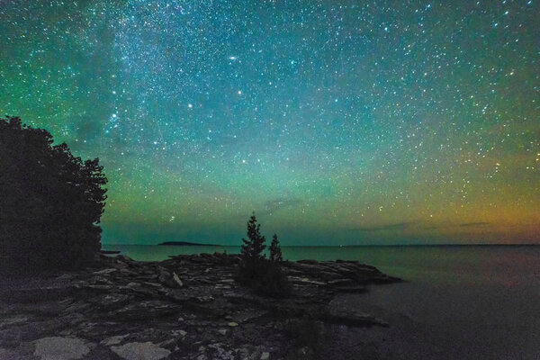 Milky way and starry sky along the lakeshore of Georgian Bay at 