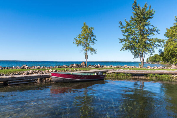 Lake Manitou shoreline fishing boat moored at dock landscape