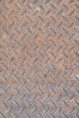 Sıkıntılı, benekli, gungy endüstriyel kaba, inşaat, ağır ekipman için duvar kağıdı için mükemmel elmas kavrama desenli chequerplate paslı metal arka plan doku closeup ve