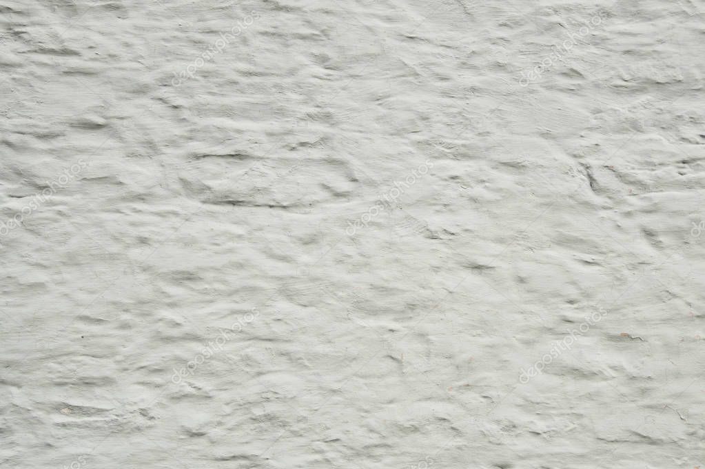 Fondo de pared de piedra vieja blanqueada que es áspera y rechinada 2022