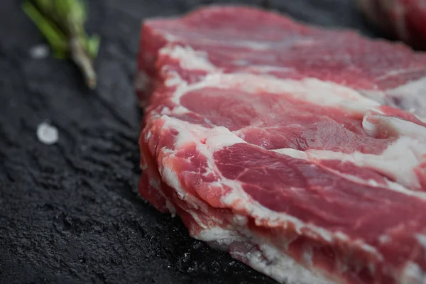Two Fresh Raw Boneless Pork Shoulder Butt Slices Black Stone — Stockfoto