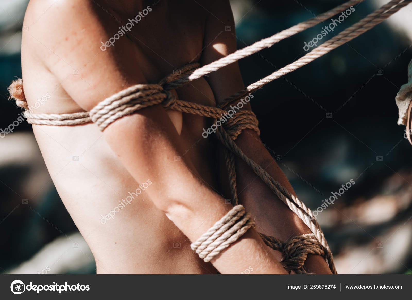Woman bound with a rope in Japanese technique shibari outdoors — Stock  Photo © natalie_magic #259875274
