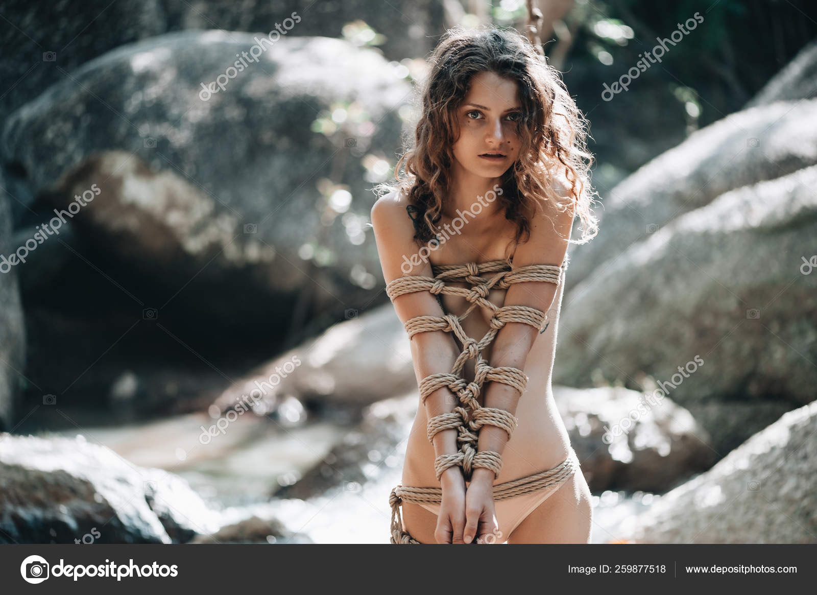 Woman bound with a rope in Japanese technique shibari outdoors — Stock  Photo © natalie_magic #259877518