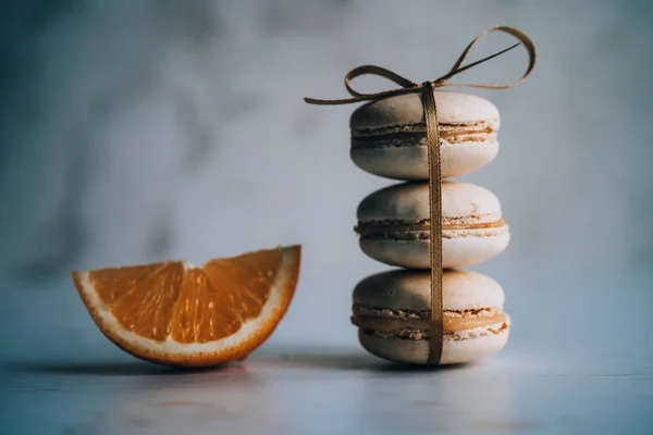 Tasty sweet orange flavour macarons — Stock Photo, Image