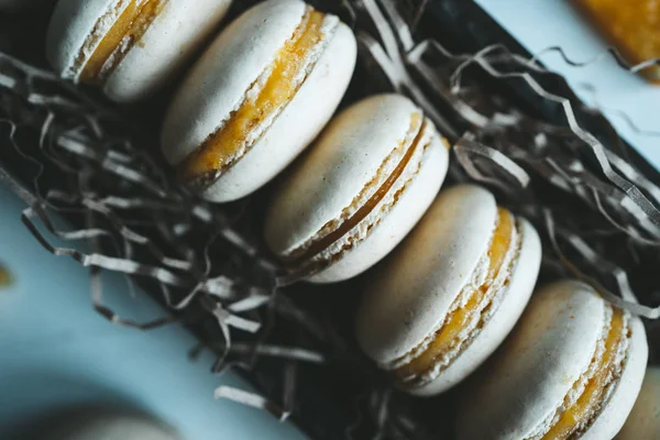 Tasty sweet orange macarons in box — Stock Photo, Image