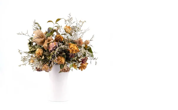 dried flowers in vase on white background