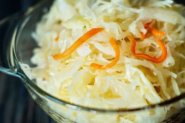 Salad homemade sauerkraut in a glass jar on a table — Stock Photo, Image