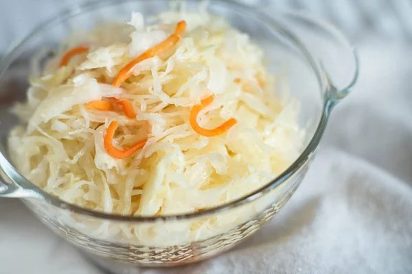Salad homemade sauerkraut in a glass jar on a table — Stock Photo, Image