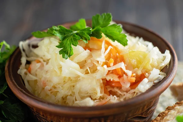 Salad homemade sauerkraut in a glass jar on a table — Stock Photo, Image