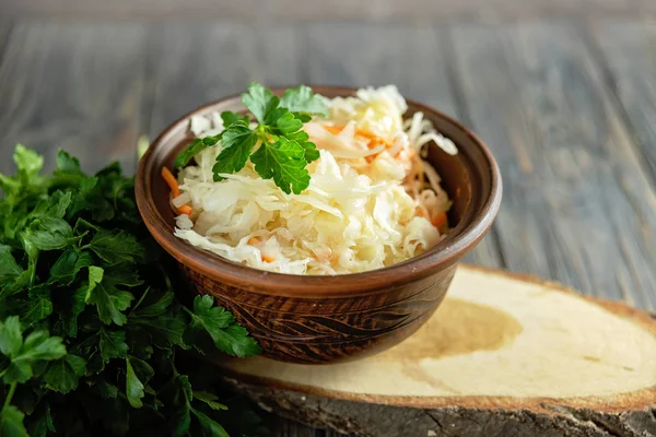 Salad homemade sauerkraut in a glass jar on a table — Stock Photo, Image