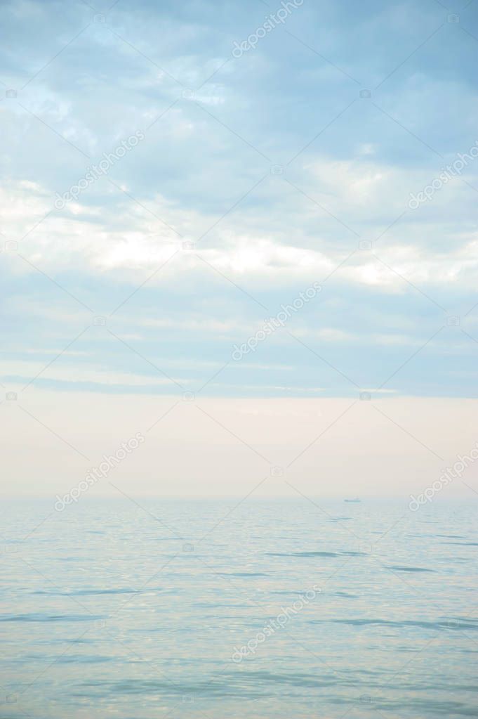 Painterly seascape scene with water surface and horizon on blue sky background