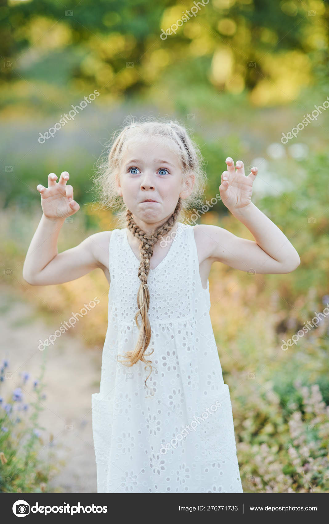 Funny Girl Holding Hair Plaits Small Cute Girl With Long Blonde