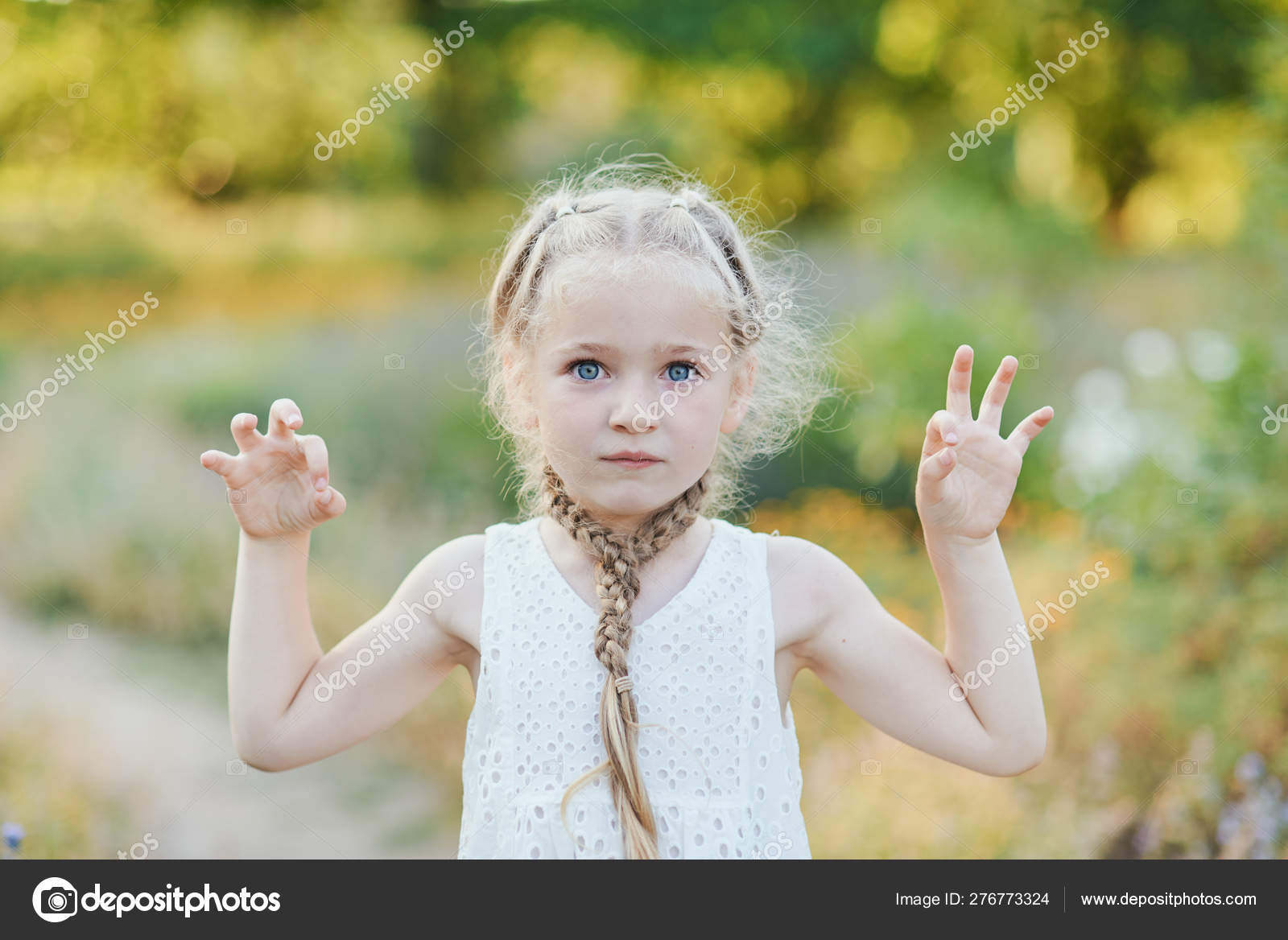 Funny Girl Holding Hair Plaits Small Cute Girl With Long Blonde