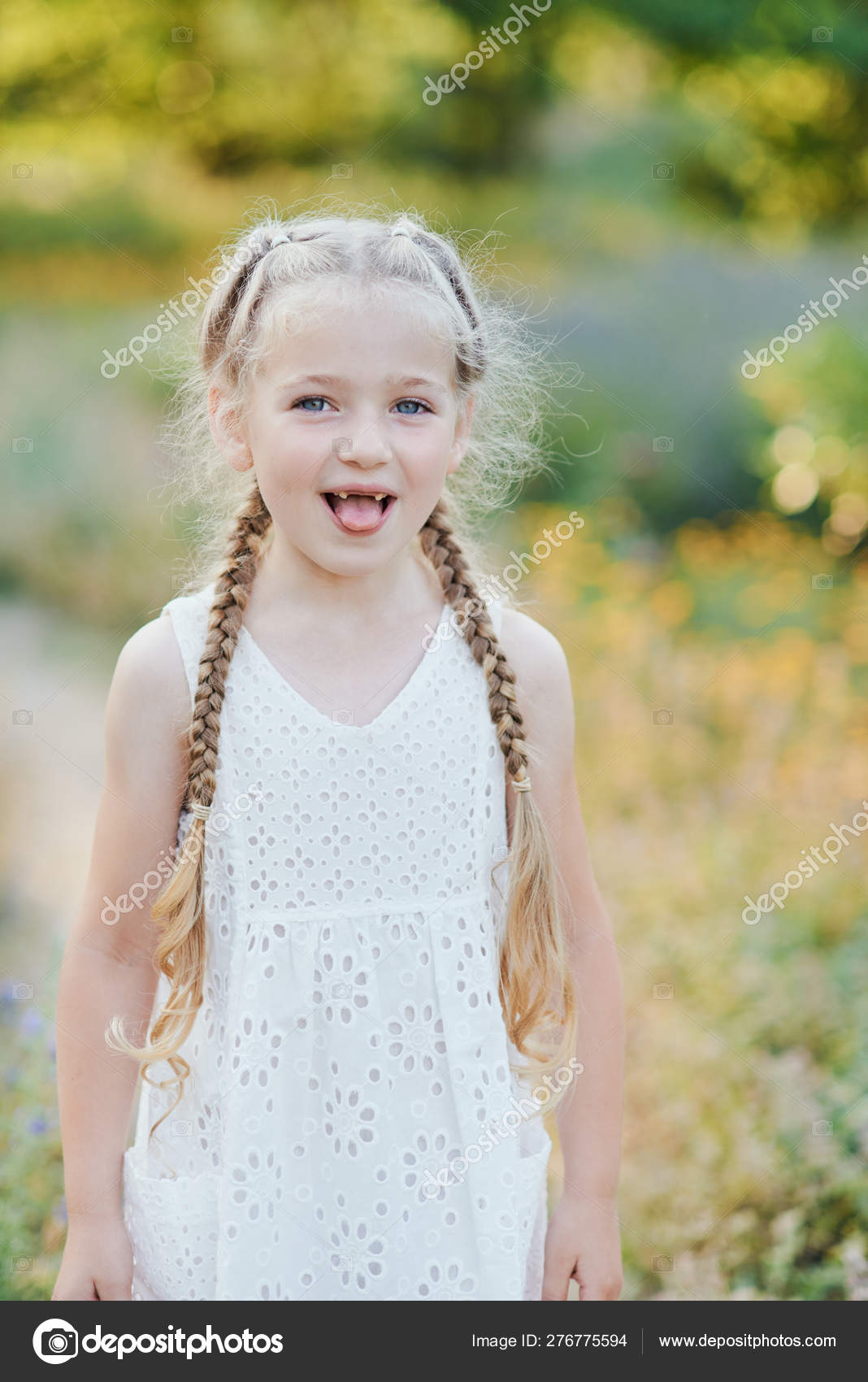Funny Girl Holding Hair Plaits Small Cute Girl With Long Blonde