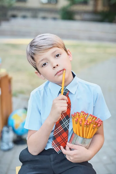 Portrait of a happy school boy with pencils. Farewell Bell. day of knowledge. beginning of the school year. — Stock Photo, Image