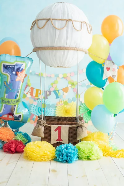 toy air balloon with decorations for boy first birthday, celebration concept