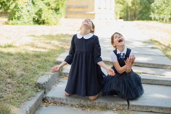 sad children don\'t want to go to school. concept new academic year, education, training. back to school. Portrait of unhappy and sad girls in school uniform not want to go school.