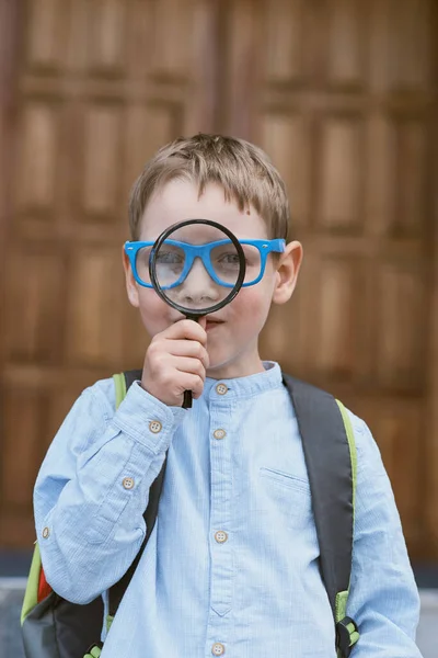 Portrait Schoolboy Looking Magnifying Glass Farewell Bell Day Knowledge Beginning — Stock Photo, Image