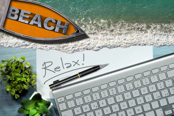 Dreaming summer vacation at work. Workspace with computer keyboard, pencil with text Relax, sea waves and wooden boat with text Beach.