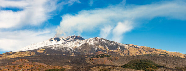 The mount Etna Volcano with smoke in winter. Catania, Sicily island, Italy, Europe